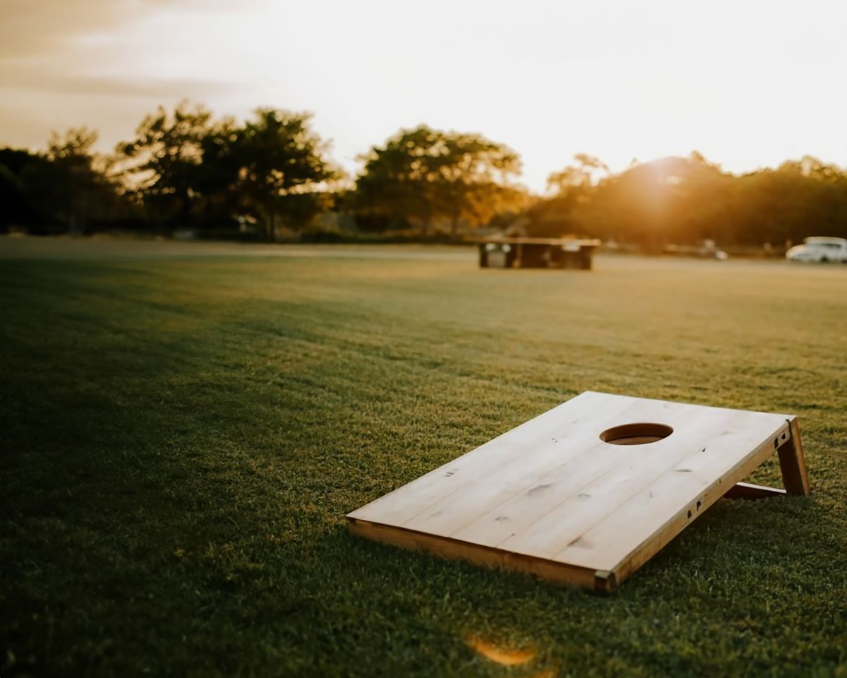 cornhole board on grass lawn